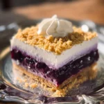 Blueberry Delight No Bake Dessert topped with fresh blueberries and whipped cream
