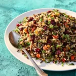 Cranberry Wild Rice Pilaf with cranberries and herbs in a bowl