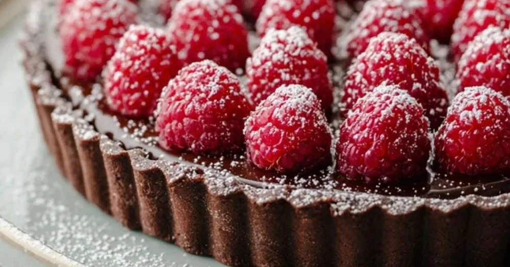 Deliciously easy chocolate raspberry tart with rich chocolate and fresh raspberries.