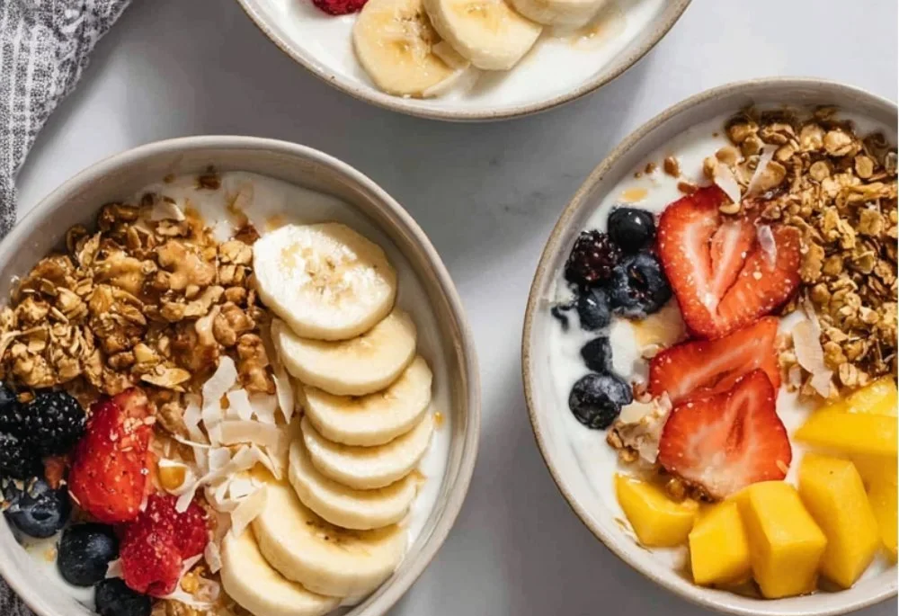 Delicious yogurt granola bowls with fresh fruits and nuts