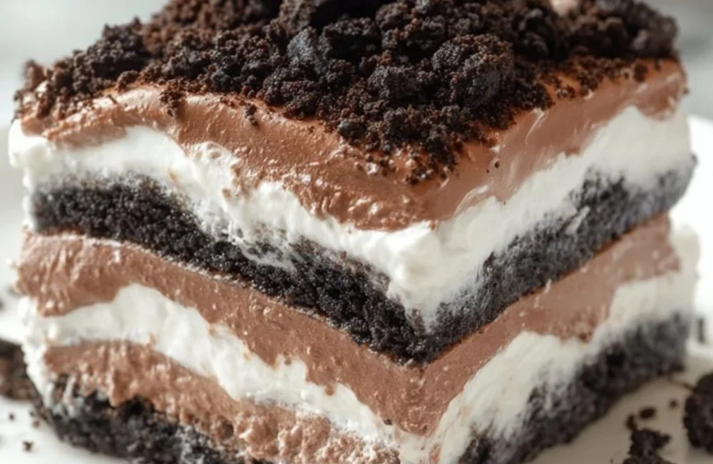 Five layer Oreo lasagna dessert with cookies and cream layers