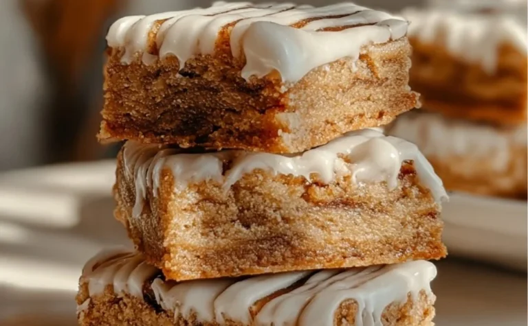Delicious Cinnamon Roll Bliss Bars topped with icing and spices