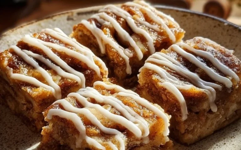 Delicious Cinnamon Roll Bliss Bars topped with creamy frosting and cinnamon swirls