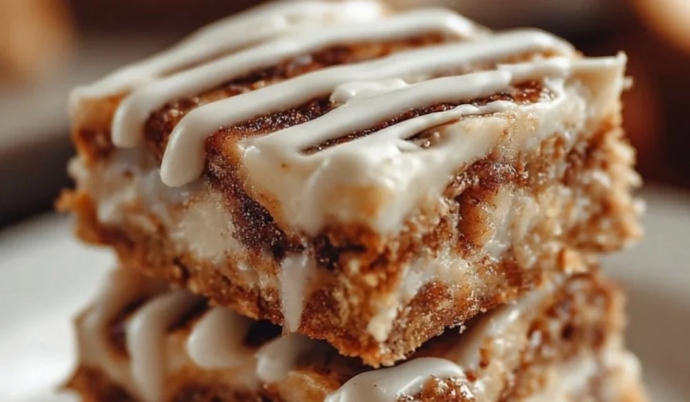 Delicious Cinnamon Roll Bliss Bars topped with cream cheese frosting