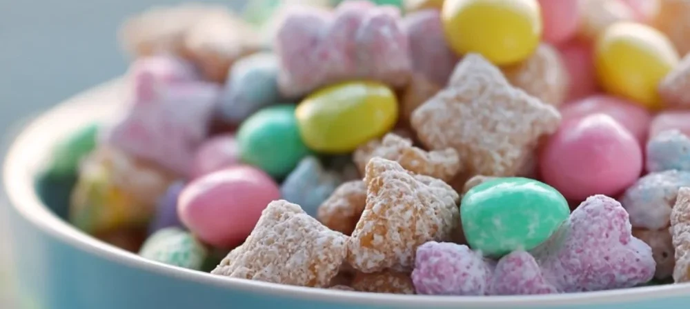 Colorful Easter Bunny Chow mix with festive treats and chocolate.