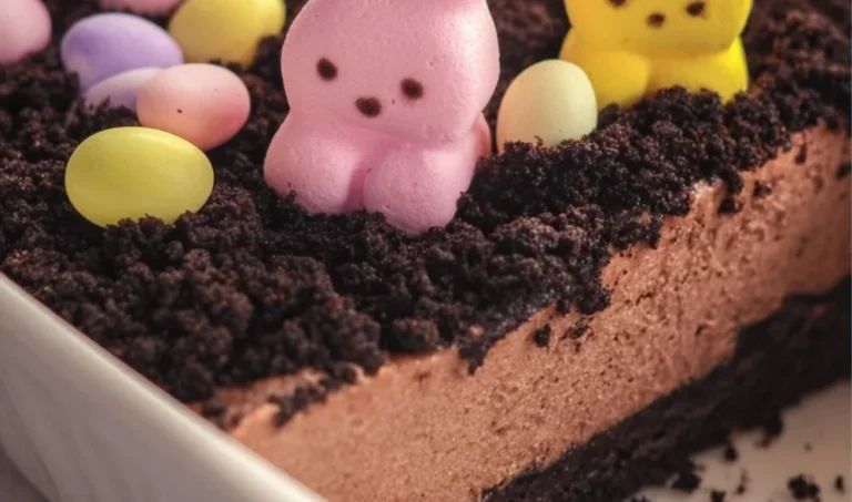 Easter Dirt Cake decorated with chocolate crumbs and colorful candies