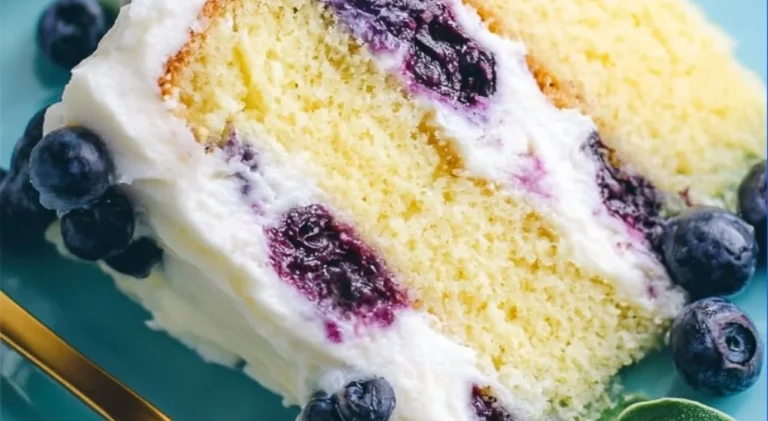 Lemon Blueberry Cake topped with fresh blueberries and lemon zest