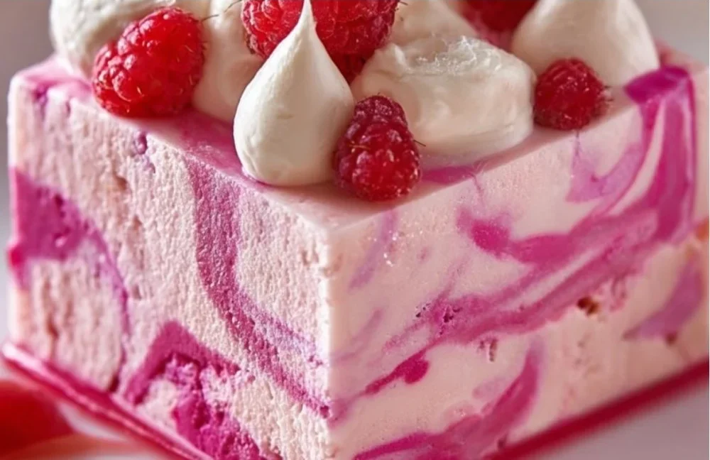 Delicious Raspberry Swirl Cheesecake with a creamy texture and vibrant raspberry topping